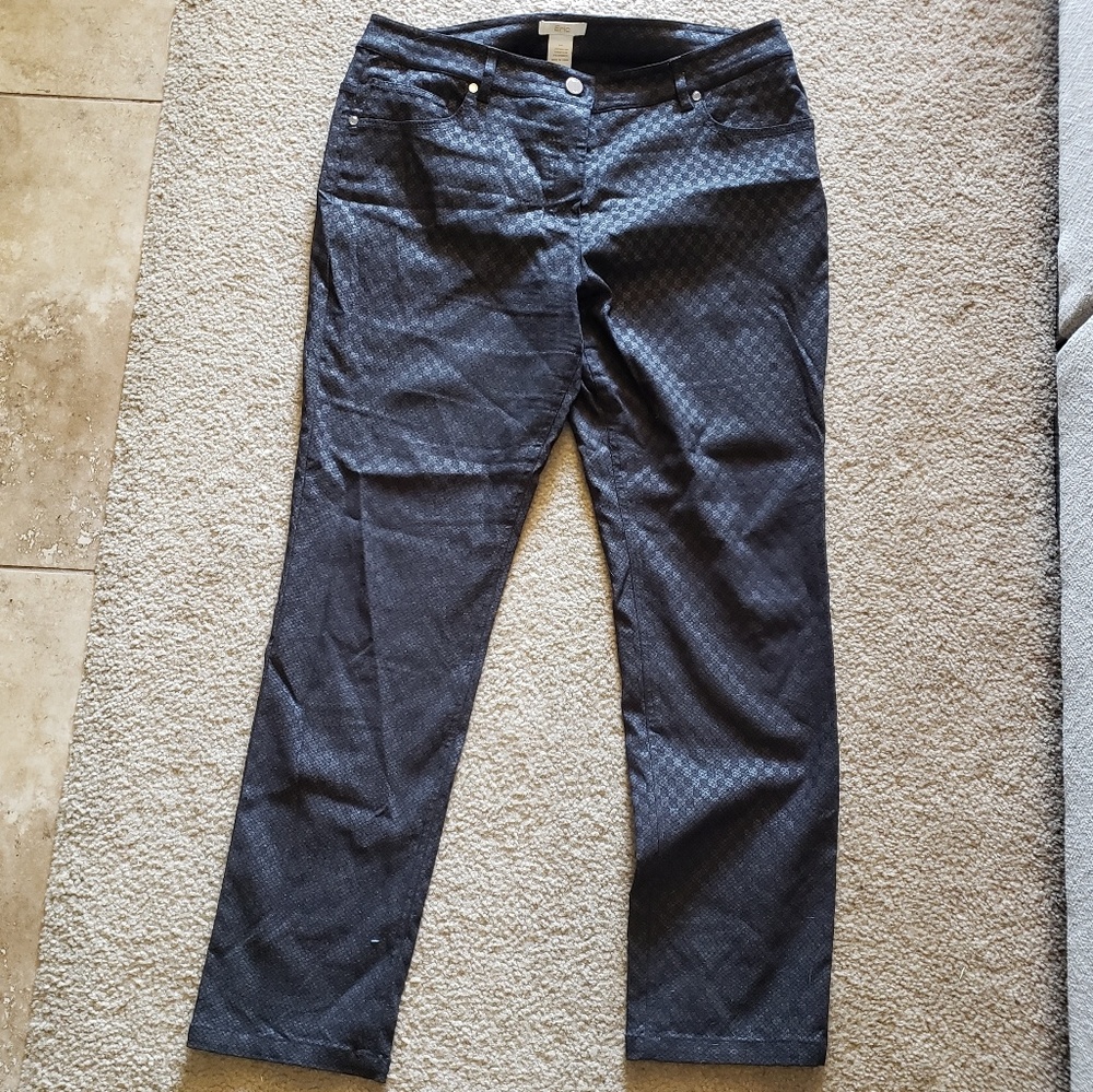 Black trouser pants with a textured sheen.